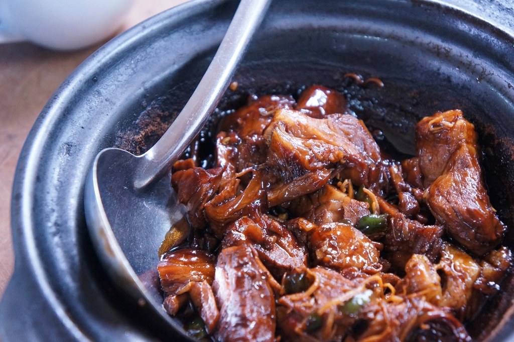 Tender braised beef in a dark bowl